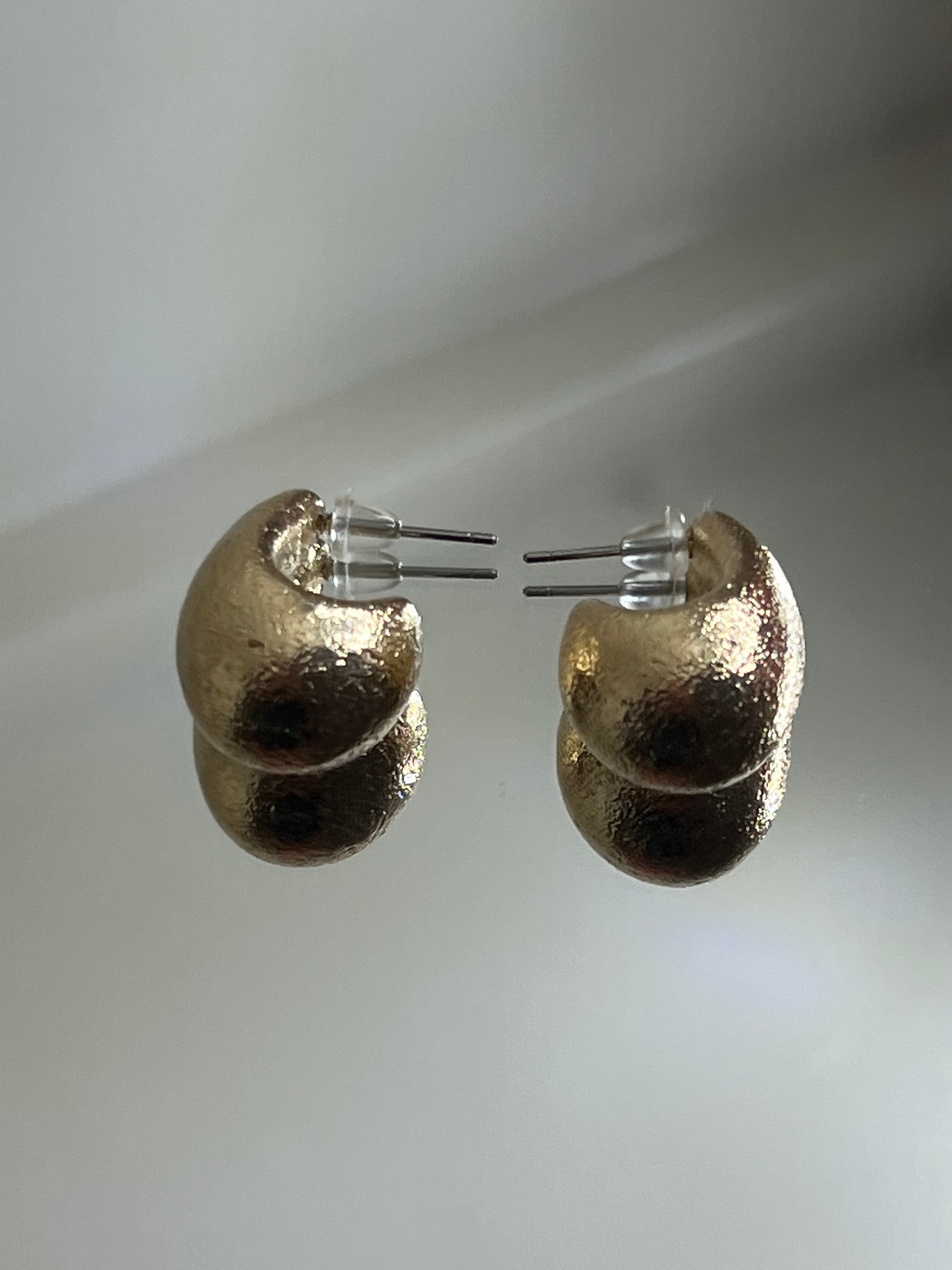 Gold crescent earring