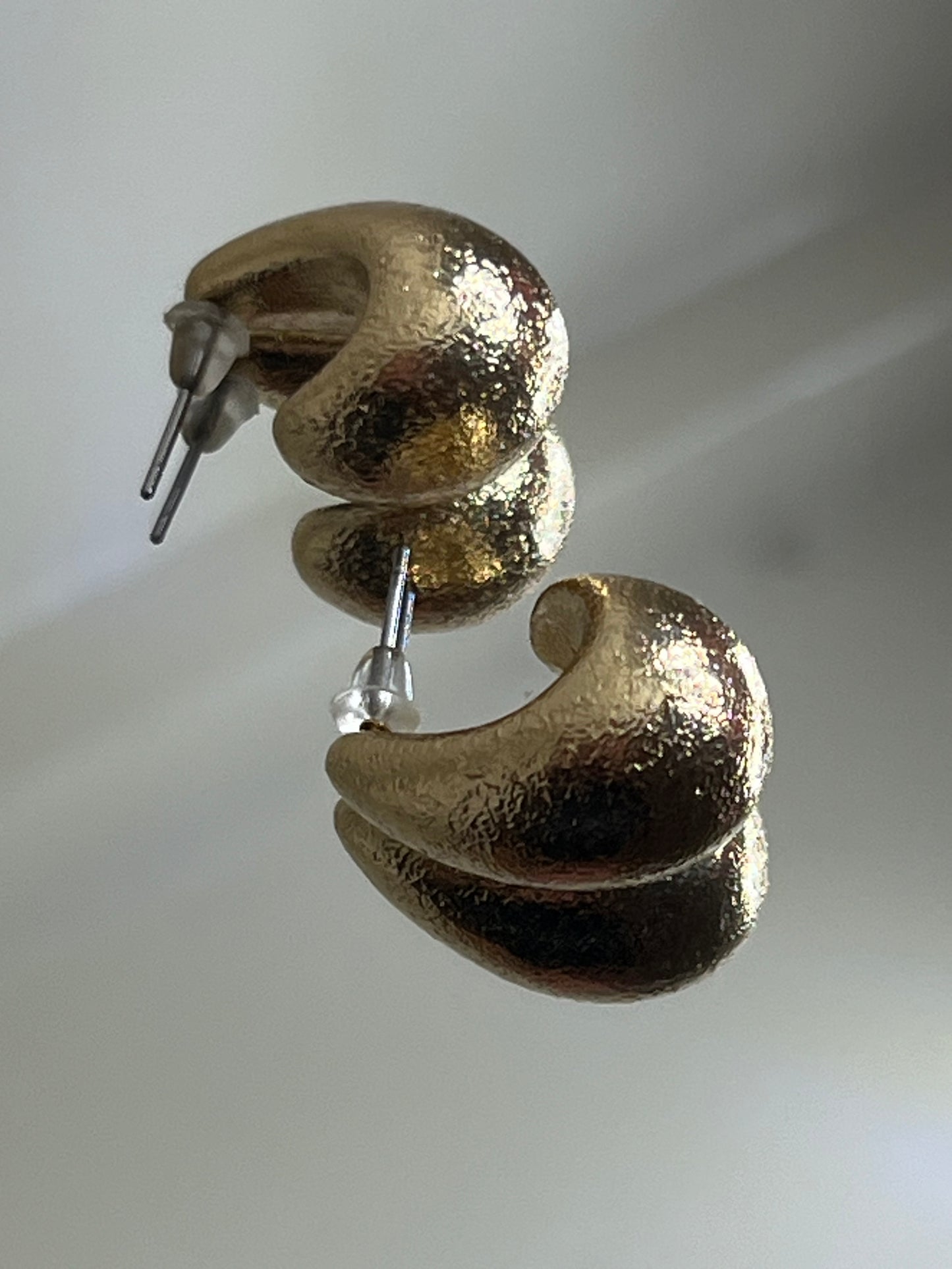 Gold crescent earring